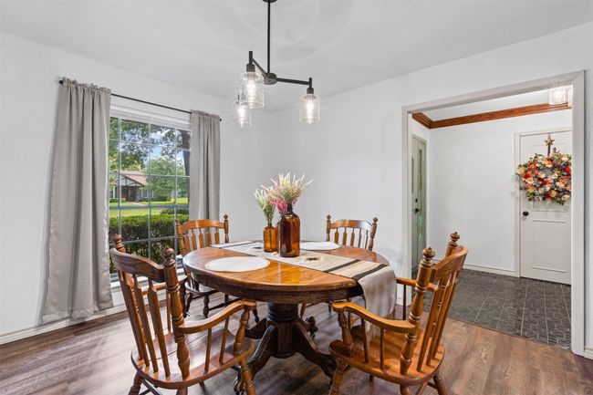 Dining space featuring wood finished floors | Image 14