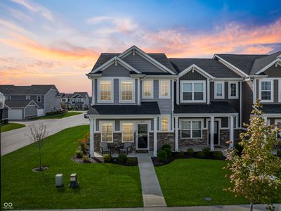 Beautiful curb appeal with a front and side yard - end unit, front sitting porch & private back patio | Image 1