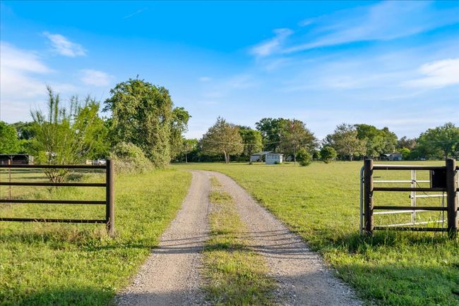 View of street featuring a rural view and a gated entry | Image 5