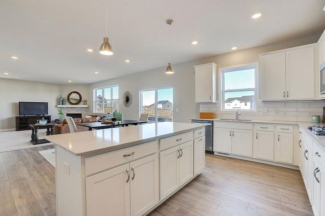Another look at the kitchen, which is loaded with the perfect combination of function and beauty!! Photo of model home, color and options will vary. | Image 5
