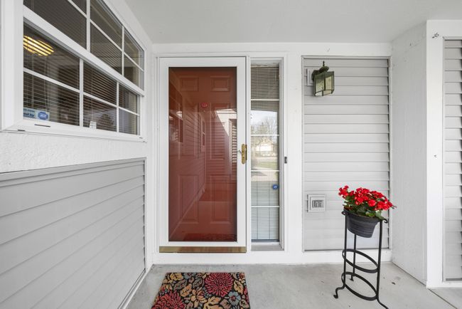 Welcoming front entrance with storm door | Image 6