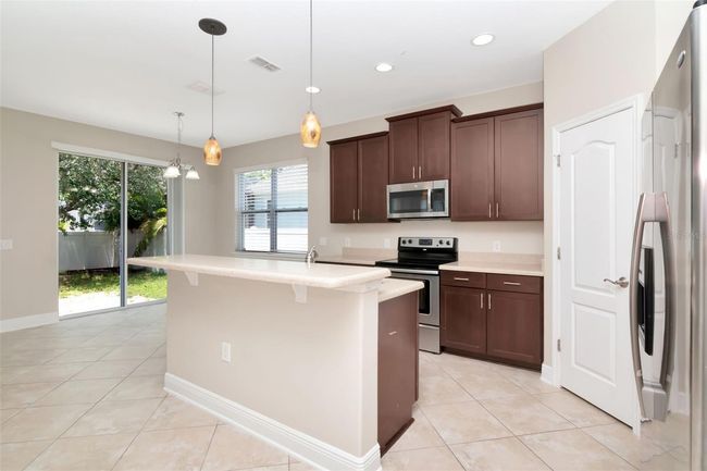 7703 S Fitzgerald St, House other with 4 bedrooms, 3 bathrooms and null parking in Tampa FL | Image 6