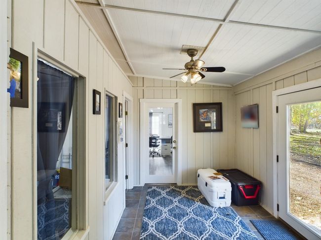Sunroom featuring vaulted ceiling | Image 13