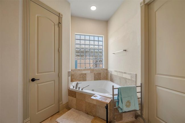 a tub for two and a separate, luxurious restroom. | Image 23