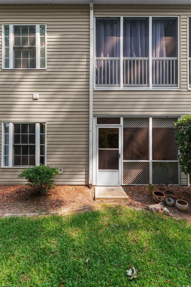 Back of house featuring a sunroom | Image 34