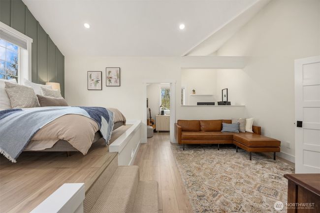 The primary suite connects to a separate small room that can be used as another closet or an office. | Image 21