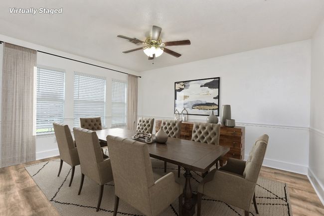 This space is virtually staged to show this room being used as a great dining/gathering space! | Image 5