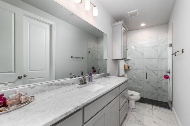 Full bathroom with marble finish floors, a marble finish shower, vanity, toilet, and recessed lighting | Image 21