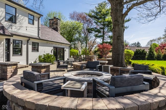 view of patio featuring an outdoor living space with a fire pit | Image 52