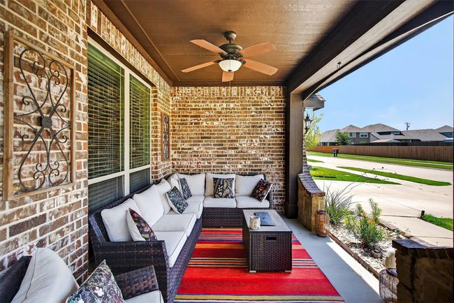 View of patio / terrace featuring a ceiling fan and outdoor lounge area | Image 4