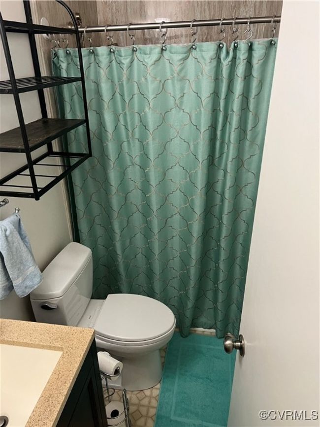 Bathroom featuring vanity and a shower with curtain | Image 14