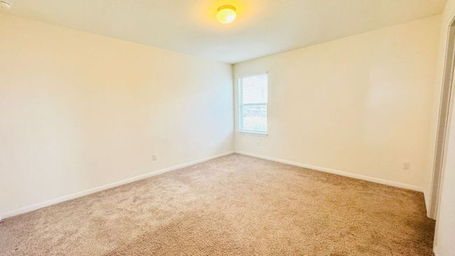 Empty room featuring light colored carpet and baseboards | Image 33