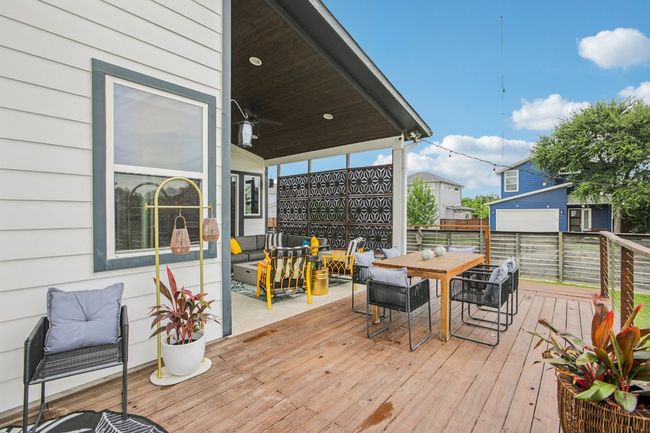 Wooden terrace featuring outdoor dining space | Image 35