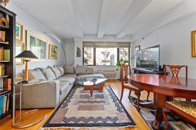 Living room featuring light hardwood / wood-style floors and beamed ceiling | Image 21