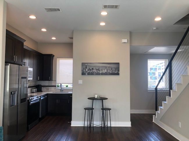 Galley style Kitchen featuring a sink & stainless steel appliances | Image 7