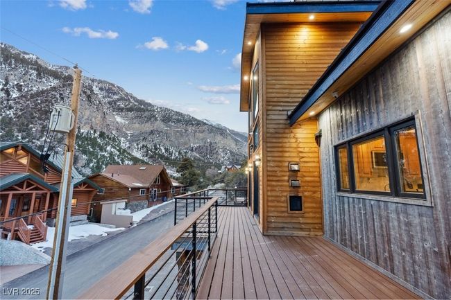 Snow covered deck with a mountain view | Image 81