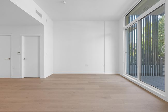 Spare room featuring light wood finished floors | Image 13