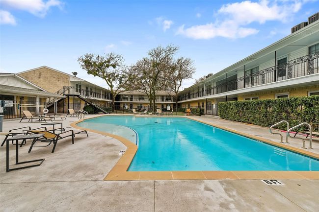Community pool with a patio area | Image 17