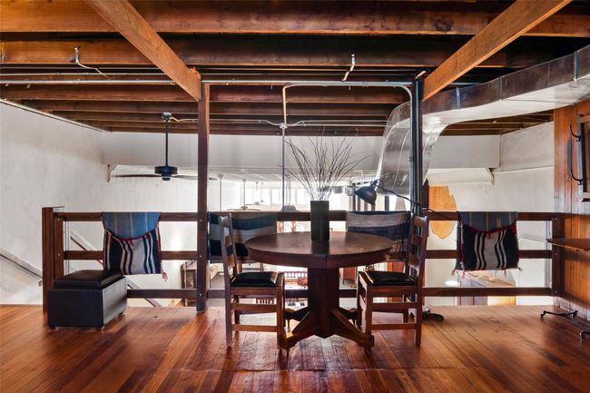 Dining area featuring a ceiling fan and hardwood / wood-style floors | Image 21
