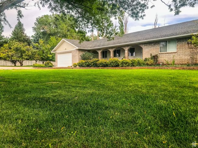 Spacious yard and view of front of home | Image 42