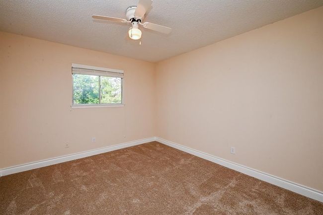 All secondary bedrooms are located on the second floor and are carpeted. This is bedroom #1 of 3. | Image 22