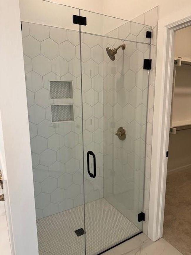 Bathroom with marble finish floor, a spacious closet, and a stall shower | Image 24
