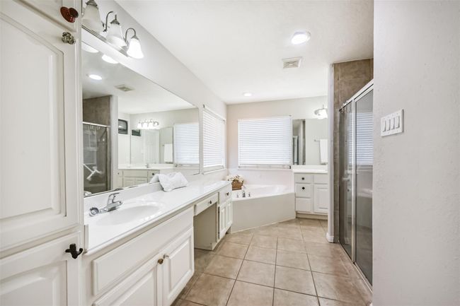 Primary bath with separate oversized shower and whirlpool tub. | Image 12
