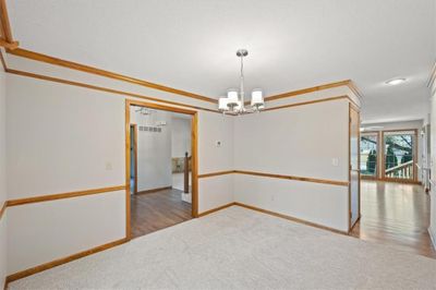 Dining room open to entry and kitchen | Image 3