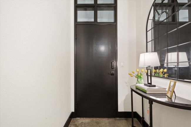 Entrance foyer featuring baseboards and concrete flooring | Image 17