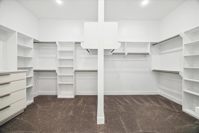 PRIMARY CLOSET: Designed with both style and functionality in mind, this closet offers ample space to accommodate your wardrobe and accessories while keeping everything neatly organized. | Image 36