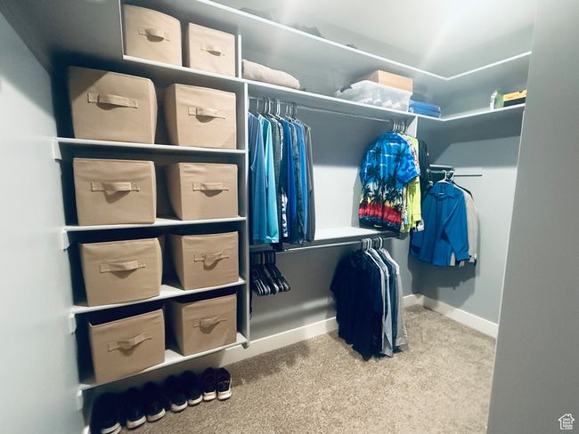 Walk in closet featuring carpet flooring | Image 59