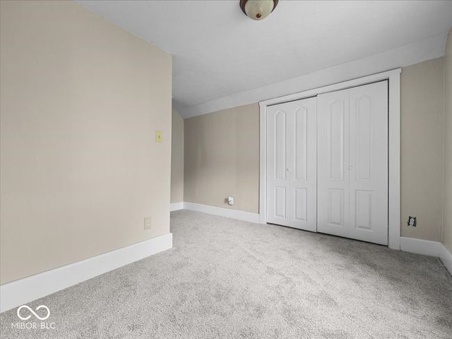 unfurnished bedroom featuring carpet floors and a closet | Image 18