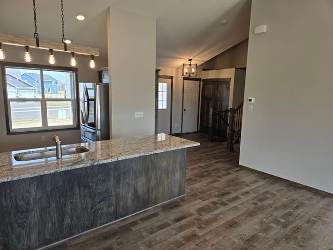 A view from the kitchen/dining area looking into the foyer area. | Image 8