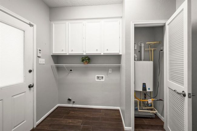 Note the tankless water heater and gas or electric hookups for your W/D. | Image 13