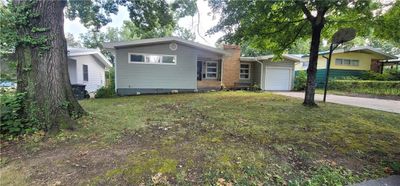 View of front of property with a front lawn and a garage | Image 2