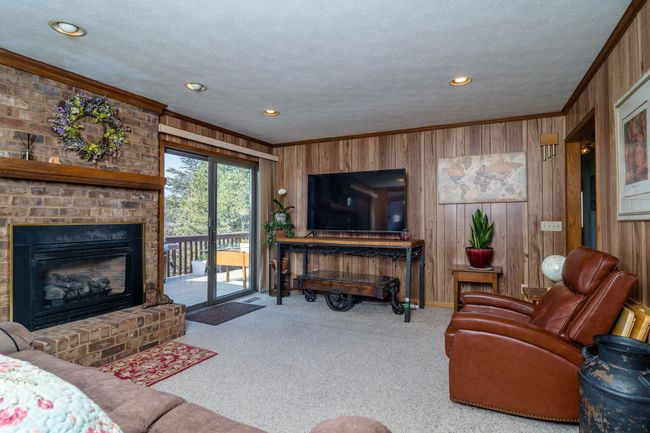 with gas fireplace and access to rear deck. | Image 9