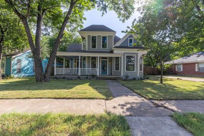 View of front facade featuring a front yard and covered porch | Image 2