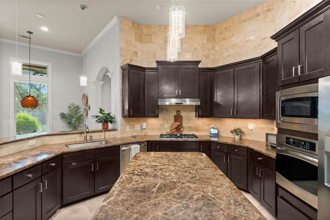 Thoughtfully planned for both functionality and style, it includes a spacious layout perfect for preparing gourmet meals, entertaining guests, and everyday living. | Image 18