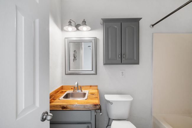 Bathroom with toilet and vanity | Image 18