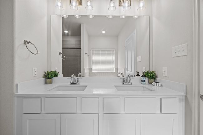 Full bathroom with a tile shower and double vanity | Image 20