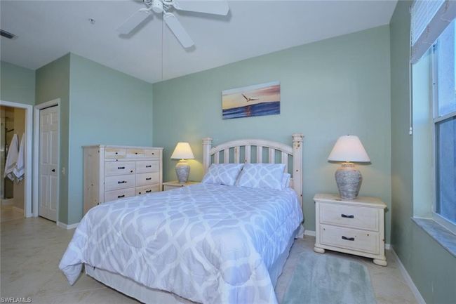 Bedroom with ceiling fan and a closet | Image 36