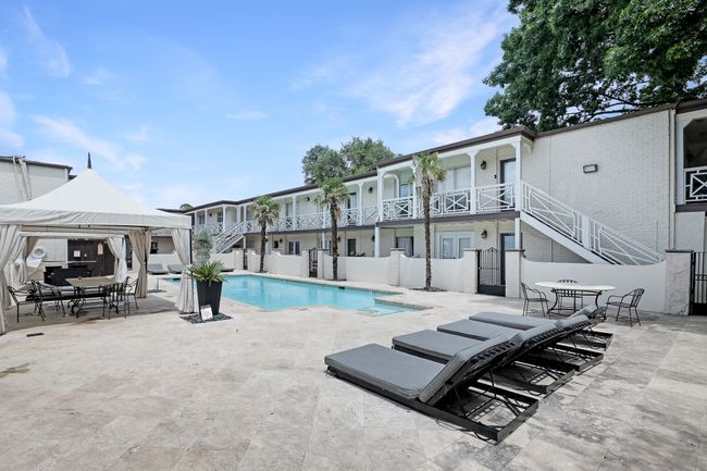 View of swimming pool featuring stairs, a gazebo, and a patio area | Image 19