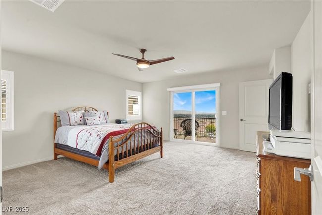 Carpeted bedroom featuring access to exterior and ceiling fan | Image 32