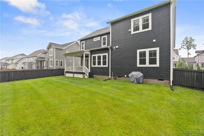 Rear view of property with crawl space and a residential view | Image 45