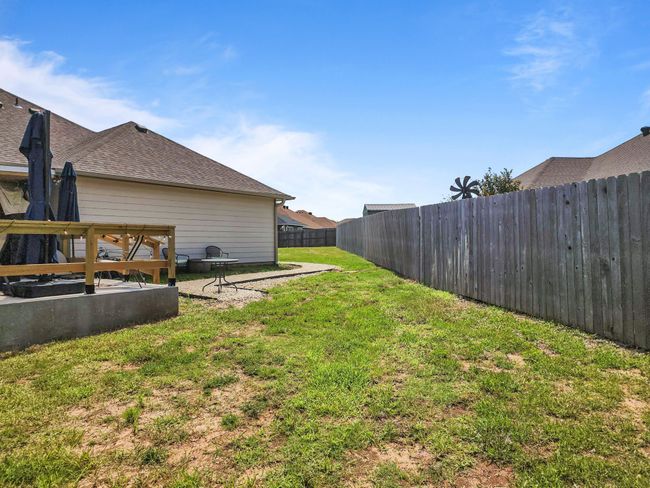 View of fenced backyard | Image 34