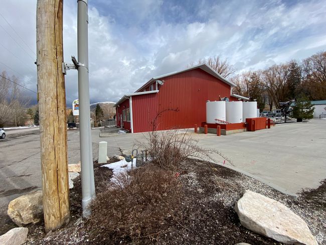 View of property exterior with an outdoor structure and an outbuilding | Image 13