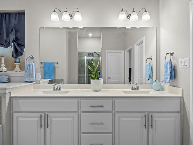 Full bathroom with a shower stall and double vanity | Image 17