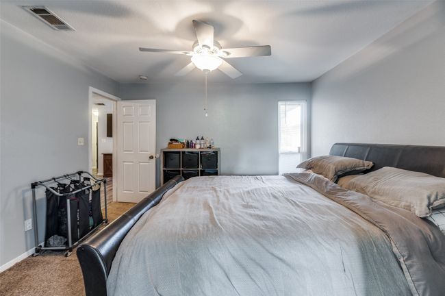 Carpeted bedroom with ceiling fan | Image 14
