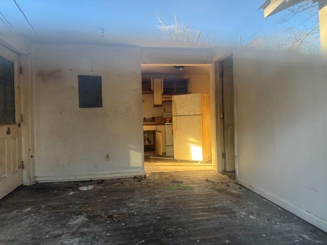 Spare room featuring washing machine and dryer and electric panel | Image 10