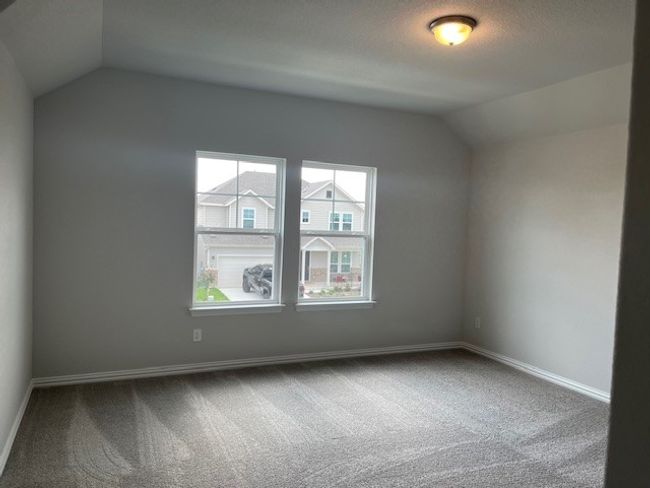 Bonus room featuring lofted ceiling and carpet | Image 7